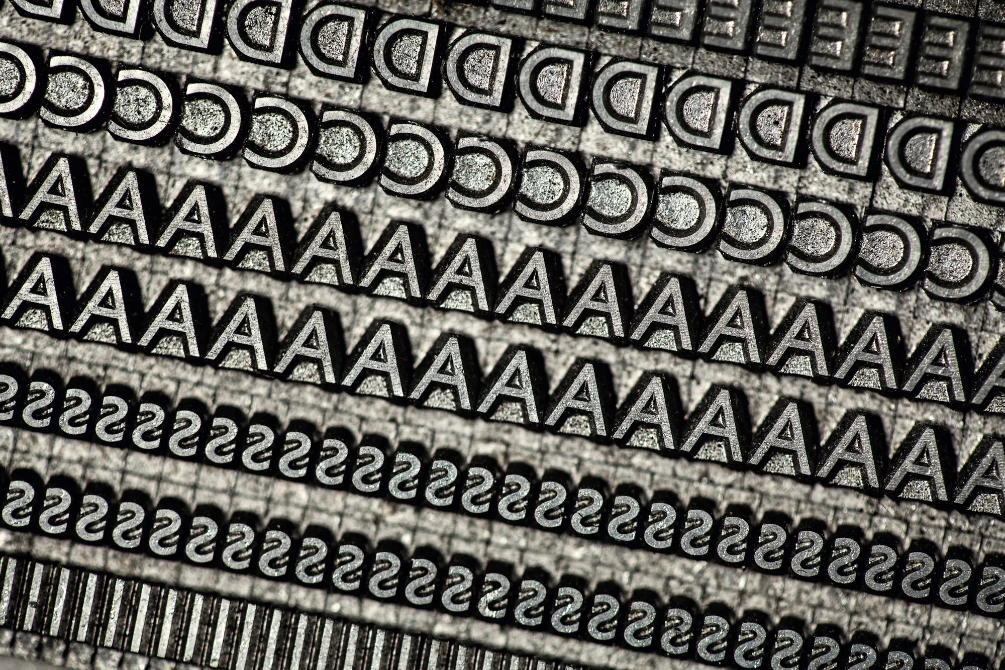 Rows of metal letterpress type