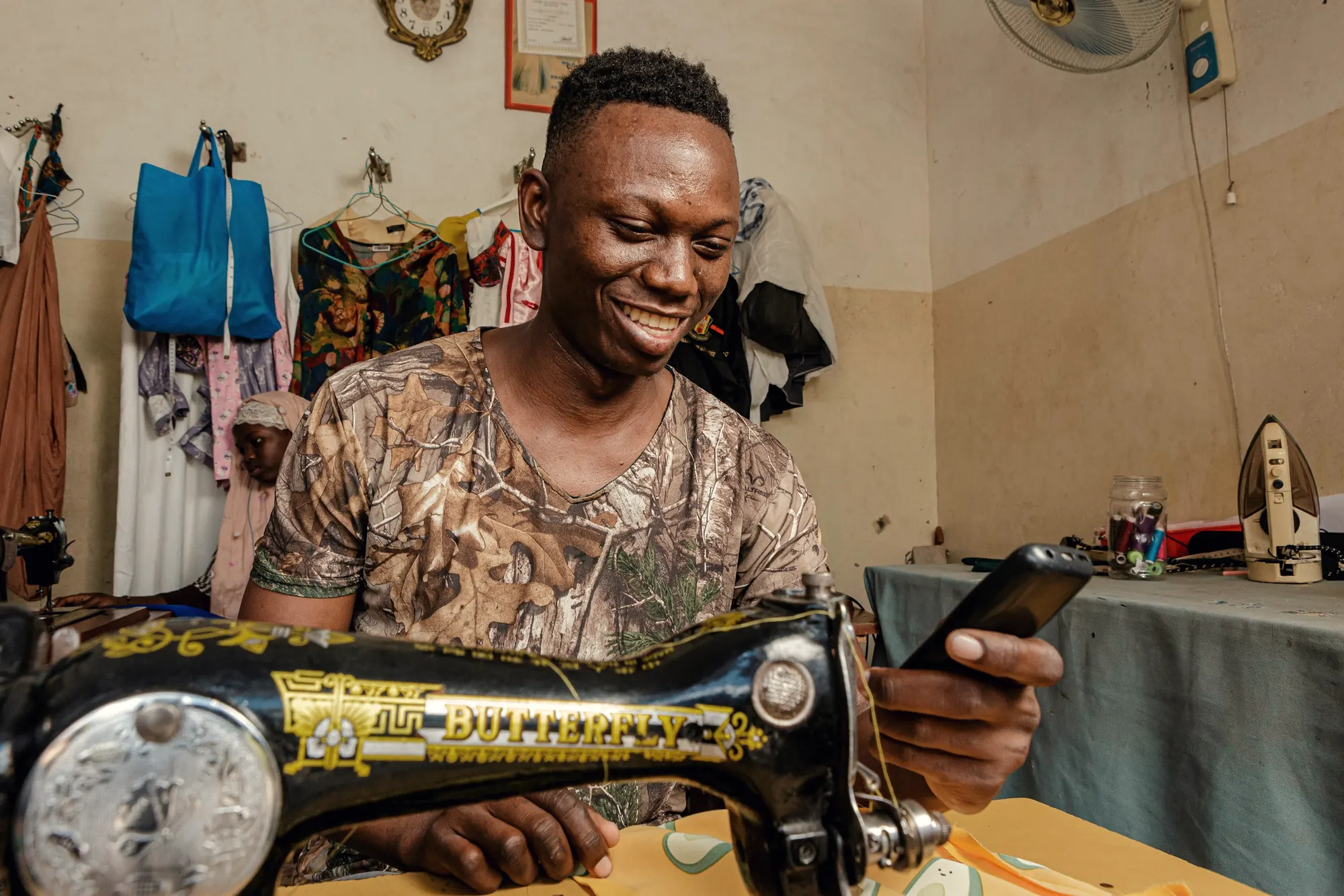 A tailor at work in his own studio